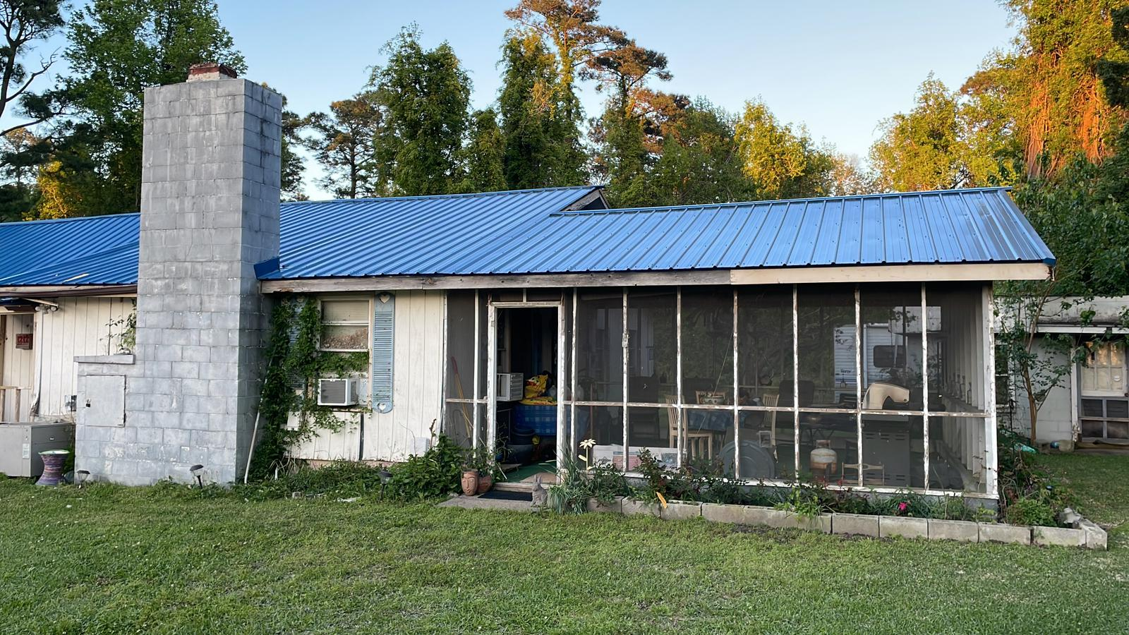 An image of a house with a metal roof